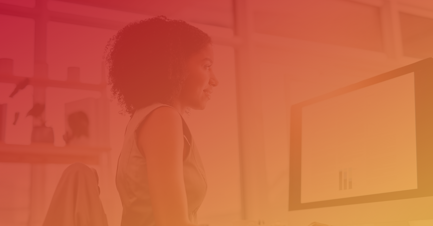 Woman working at a computer with an orange overlay